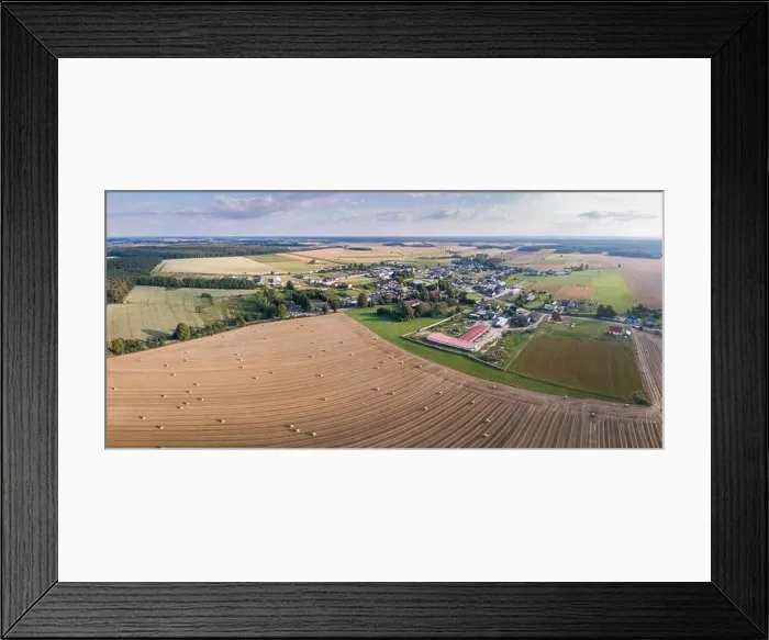 Framed Print : Aerial: Fields near village, stubble with straw bales at late summer. Drone landscape Framed Print : Aerial: Fields near village, stubble with straw bales at late summer. Drone landscape