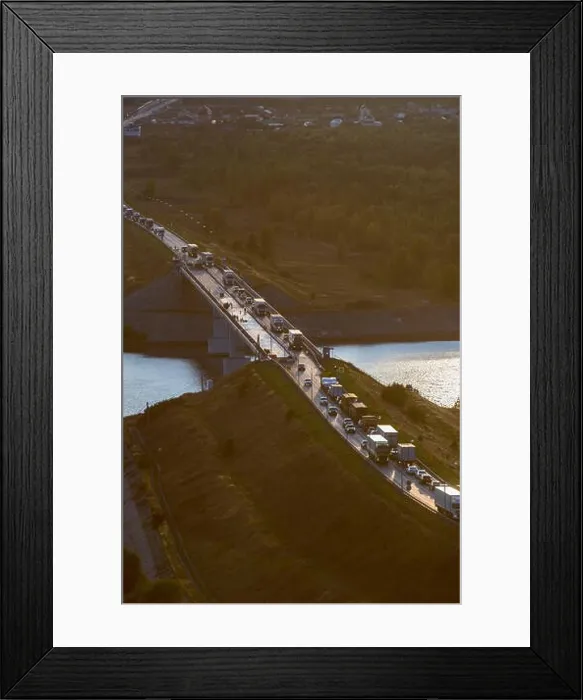 Framed Print : Stream of cars on sunset, car traffic, vertical Framed Print : Stream of cars on sunset, car traffic, vertical