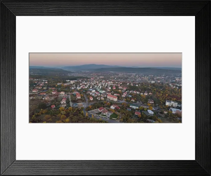 Framed Print : Aerial drone image of the cityscape of Uzhhorod Ukraine during sunset high mountains during sunset Framed Print : Aerial drone image of the cityscape of Uzhhorod Ukraine during sunset high mountains during sunset