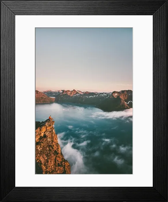 Framed Print : Norway vacations travel man sitting on the edge cliff mountains above sea alone adventure lifestyle weekend trip getaway Framed Print : Norway vacations travel man sitting on the edge cliff mountains above sea alone adventure lifestyle weekend trip getaway