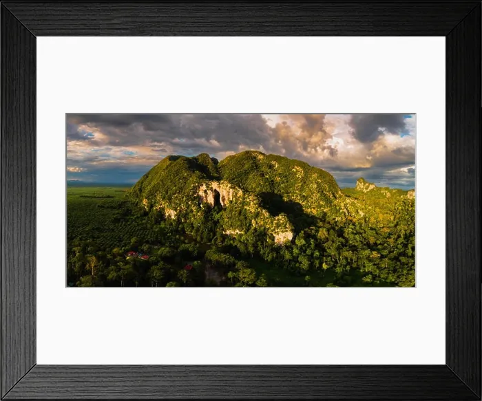 Framed Print : Magnificent aerial view of a limestone mountain with massive cave entrance Framed Print : Magnificent aerial view of a limestone mountain with massive cave entrance