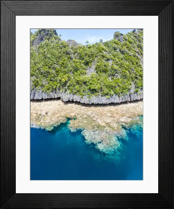 Framed Print : A fringing reef grows along a limestone island in Raja Ampat Framed Print : A fringing reef grows along a limestone island in Raja Ampat