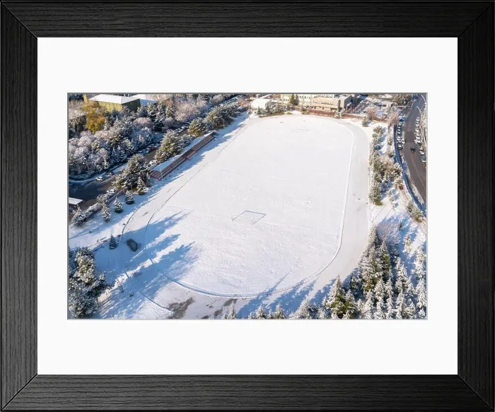 Framed Print : Ankara / Turkey-December 13 2018 - Aerial view of football field with green grass covered with snow in winter. Top view Framed Print : Ankara / Turkey-December 13 2018 - Aerial view of football field with green grass covered with snow in winter. Top view