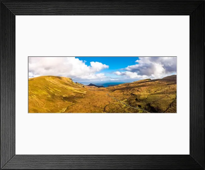 Framed Print : Flying over the mountain pass road on the top of Quiraing from Staffin to Uig - Isle of Skye, Scotland - United Kingdom Framed Print : Flying over the mountain pass road on the top of Quiraing from Staffin to Uig - Isle of Skye, Scotland - United Kingdom