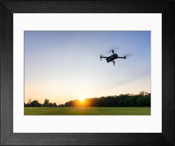 Framed Print : Drone flying over landscape. UAV drone copter flying with digital camera Framed Print : Drone flying over landscape. UAV drone copter flying with digital camera
