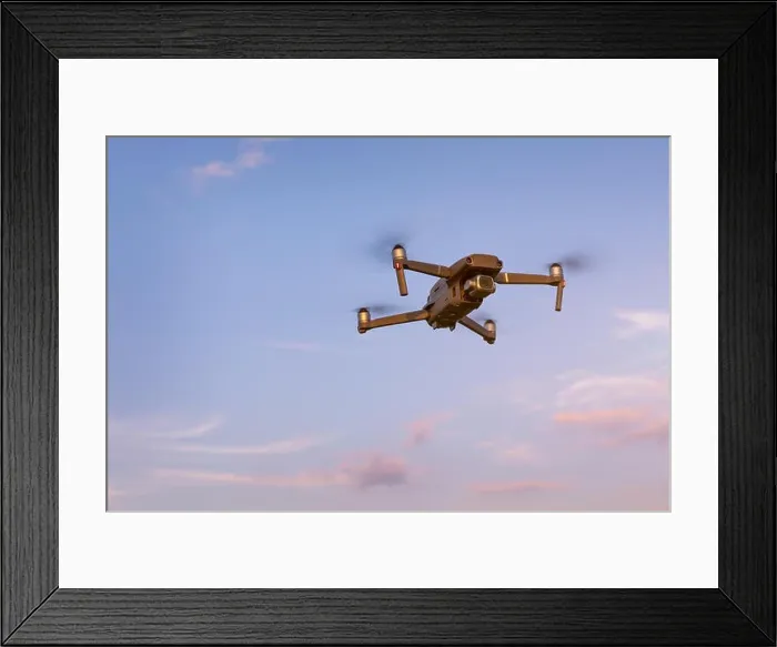 Framed Print : Drone flying over landscape. UAV drone copter flying with digital camera Framed Print : Drone flying over landscape. UAV drone copter flying with digital camera