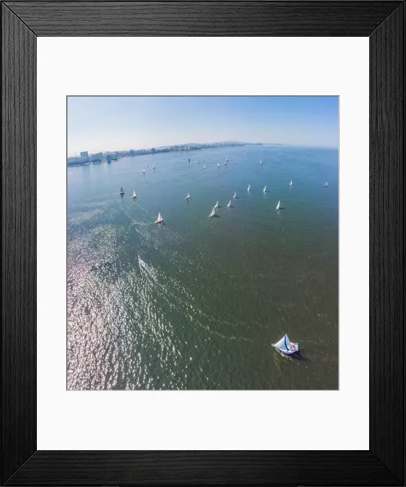 Framed Print : Aerial drone bird's eye view of beautiful purple sail boat cruising in the Aegean open sea Framed Print : Aerial drone bird's eye view of beautiful purple sail boat cruising in the Aegean open sea