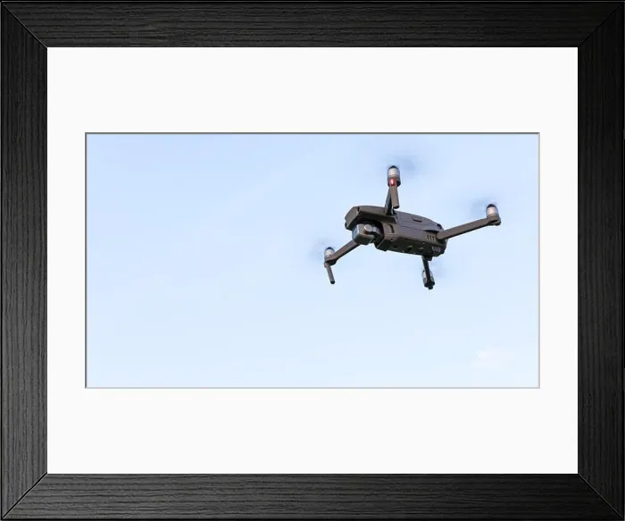 Framed Print : Drone flying over landscape. UAV drone copter flying with digital camera Framed Print : Drone flying over landscape. UAV drone copter flying with digital camera