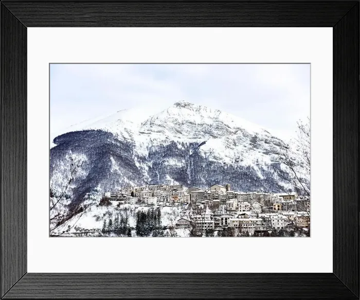 Framed Print : Aerial view of the beautiful snow-covered village of Opi with snow-capped mountains in the background Framed Print : Aerial view of the beautiful snow-covered village of Opi with snow-capped mountains in the background