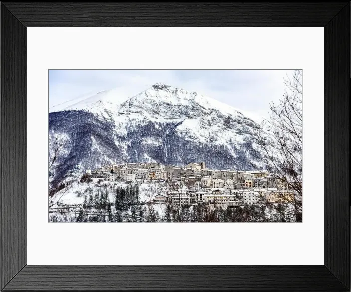 Framed Print : Aerial view of the beautiful snow-covered village of Opi with snow-capped mountains in the background Framed Print : Aerial view of the beautiful snow-covered village of Opi with snow-capped mountains in the background