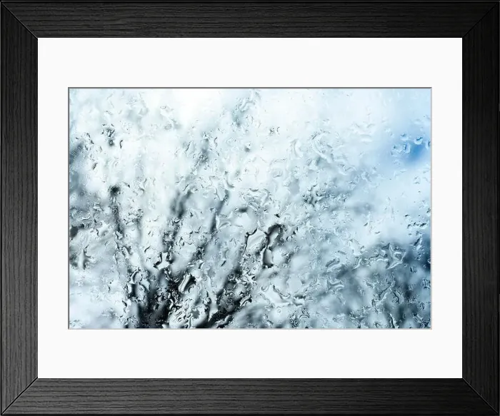 Framed Print : (selective focus) Close-up view of some drops of water on a glass during a rainy day Framed Print : (selective focus) Close-up view of some drops of water on a glass during a rainy day