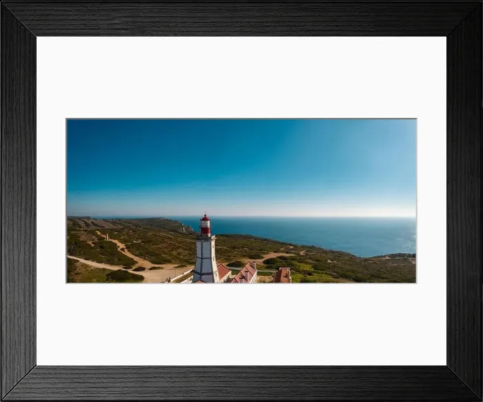 Framed Print : Aerial; drone view of white-red lighthouse Cabo Espichel on the edge of the earth; turquoise water of Atlantic ocean Framed Print : Aerial; drone view of white-red lighthouse Cabo Espichel on the edge of the earth; turquoise water of Atlantic ocean