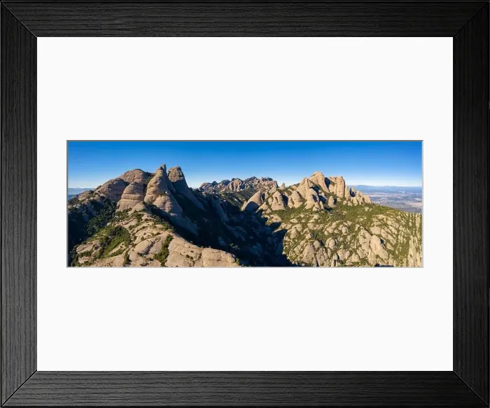Framed Print : Aerial; drone view of multi-peaked mountain range near Barcelona; sunny winter cloudless day Framed Print : Aerial; drone view of multi-peaked mountain range near Barcelona; sunny winter cloudless day