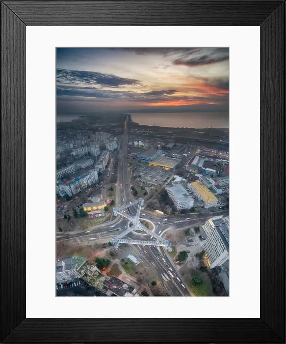 Framed Print : Panorama view of the road with a circular motion and a flower bed at sunset. Aerial photography