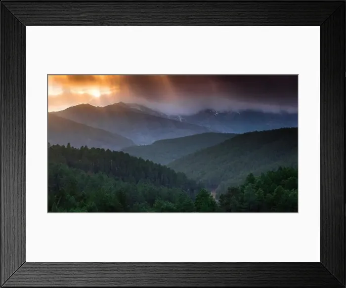 Framed Print : Majestic drone view of bright sun setting on cloudy evening sky over green hilly terrain Framed Print : Majestic drone view of bright sun setting on cloudy evening sky over green hilly terrain