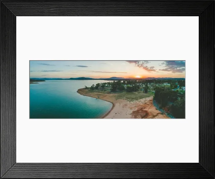 Framed Print : Sun disappearing behind mountains near Lake Hume Village - aerial panorama Framed Print : Sun disappearing behind mountains near Lake Hume Village - aerial panorama