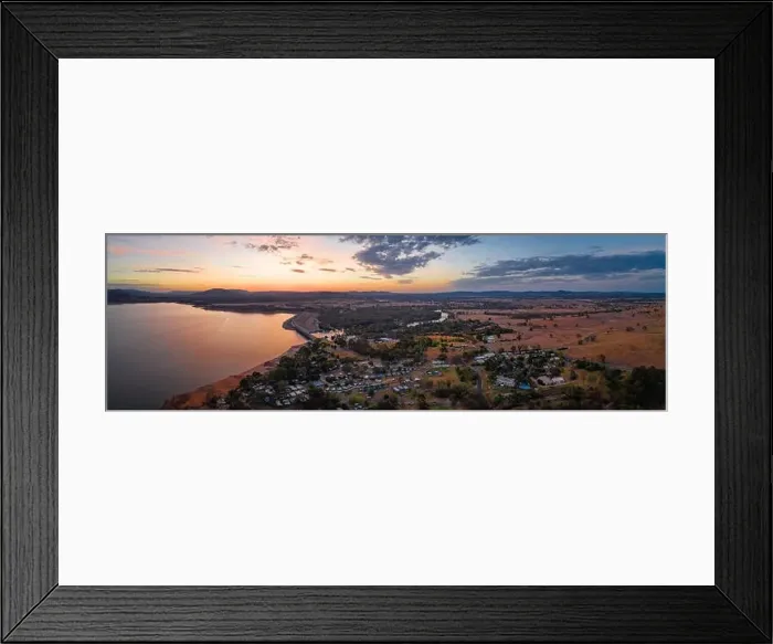Framed Print : Smooth water surface of scenic lake and beautiful countryside village at dusk - wide aerial panorama Framed Print : Smooth water surface of scenic lake and beautiful countryside village at dusk - wide aerial panorama