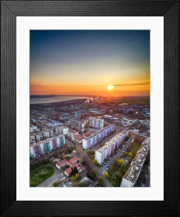 Framed Print : Panorama view of the road with a circular motion and a flower bed at sunset. Aerial photography