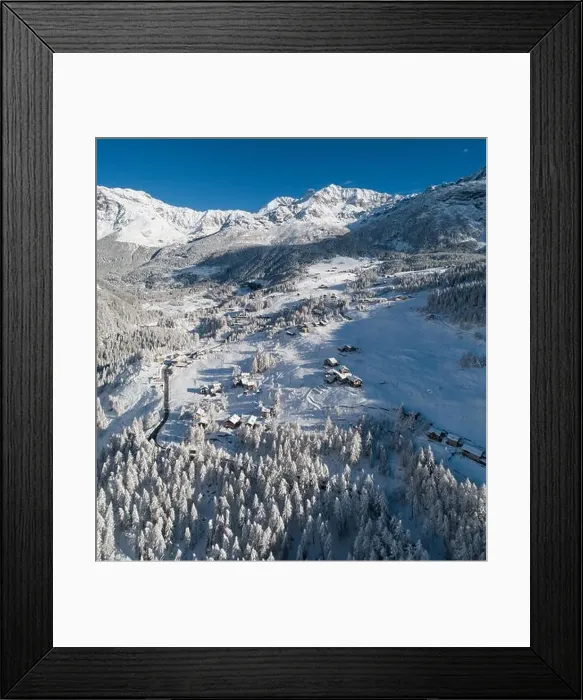 Framed Print : Alpine village and forest in winter, aerial view on the Alps Framed Print : Alpine village and forest in winter, aerial view on the Alps
