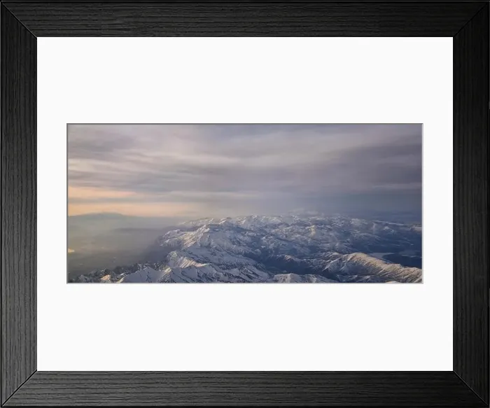 Framed Print : Aerial view from airplane of the Wasatch Front Rocky Mountain Range with snow capped peaks in winter including urban