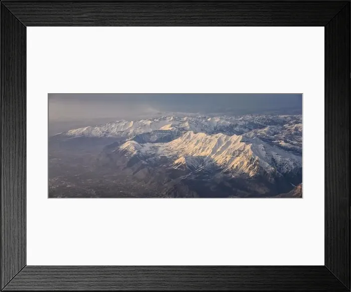 Framed Print : Aerial view from airplane of the Wasatch Front Rocky Mountain Range with snow capped peaks in winter including urban Framed Print : Aerial view from airplane of the Wasatch Front Rocky Mountain Range with snow capped peaks in winter including urban