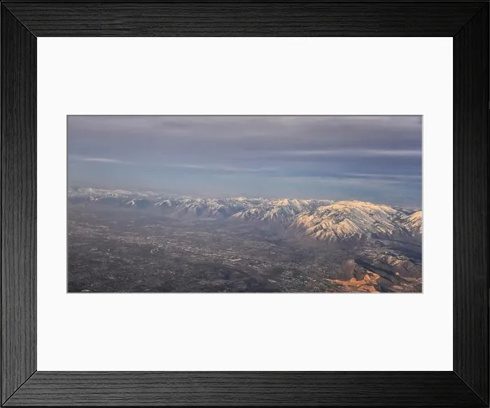 Framed Print : Aerial view from airplane of the Wasatch Front Rocky Mountain Range with snow capped peaks in winter including urban Framed Print : Aerial view from airplane of the Wasatch Front Rocky Mountain Range with snow capped peaks in winter including urban