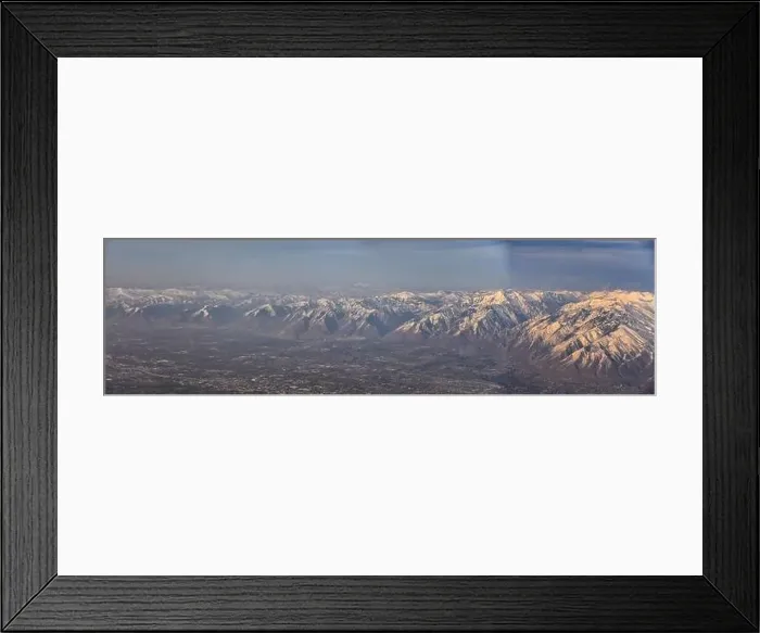 Framed Print : Aerial view from airplane of the Wasatch Front Rocky Mountain Range with snow capped peaks in winter including urban