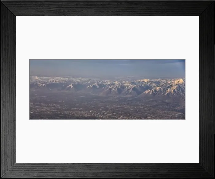 Framed Print : Aerial view from airplane of the Wasatch Front Rocky Mountain Range with snow capped peaks in winter including urban Framed Print : Aerial view from airplane of the Wasatch Front Rocky Mountain Range with snow capped peaks in winter including urban