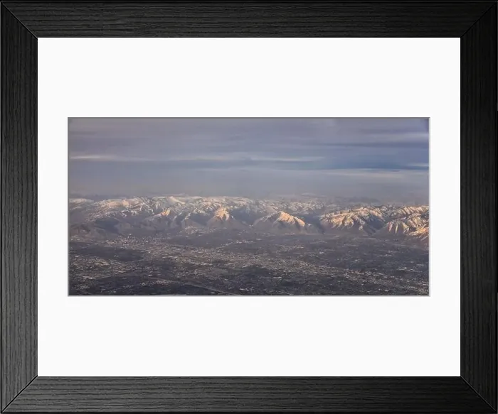 Framed Print : Aerial view from airplane of the Wasatch Front Rocky Mountain Range with snow capped peaks in winter including urban Framed Print : Aerial view from airplane of the Wasatch Front Rocky Mountain Range with snow capped peaks in winter including urban