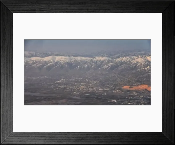 Framed Print : Aerial view from airplane of the Wasatch Front Rocky Mountain Range with snow capped peaks in winter including urban Framed Print : Aerial view from airplane of the Wasatch Front Rocky Mountain Range with snow capped peaks in winter including urban
