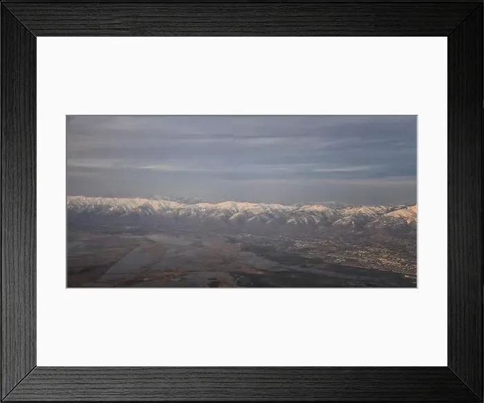 Framed Print : Aerial view from airplane of the Wasatch Front Rocky Mountain Range with snow capped peaks in winter including urban Framed Print : Aerial view from airplane of the Wasatch Front Rocky Mountain Range with snow capped peaks in winter including urban