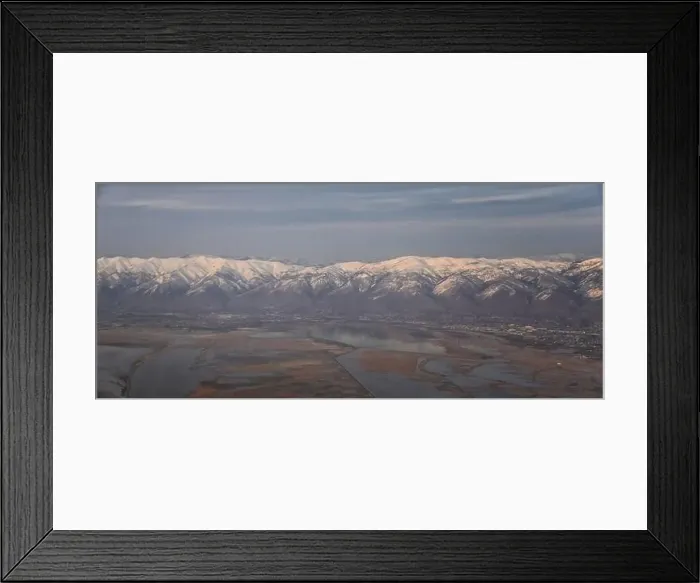 Framed Print : Aerial view from airplane of the Wasatch Front Rocky Mountain Range with snow capped peaks in winter including urban Framed Print : Aerial view from airplane of the Wasatch Front Rocky Mountain Range with snow capped peaks in winter including urban