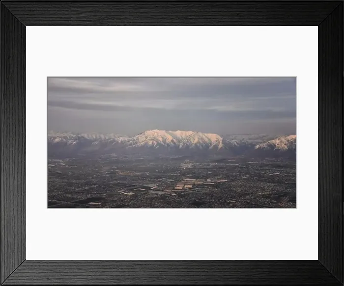 Framed Print : Aerial view from airplane of the Wasatch Front Rocky Mountain Range with snow capped peaks in winter including urban Framed Print : Aerial view from airplane of the Wasatch Front Rocky Mountain Range with snow capped peaks in winter including urban