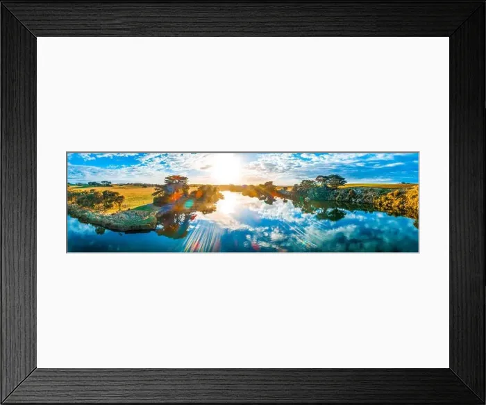 Framed Print : Sunset with sun flare over beautiful river in Australia - aerial panorama Framed Print : Sunset with sun flare over beautiful river in Australia - aerial panorama