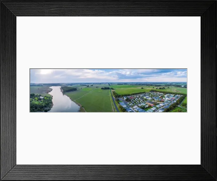 Framed Print : Wide aerial panorama of Hopkins River, Holiday Park and grasslands in Warrnambool, Australia