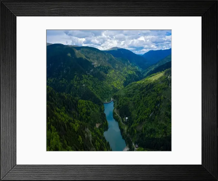 Framed Print : Aerial drone shot of a lake and green forest in Transylvania, Romania Framed Print : Aerial drone shot of a lake and green forest in Transylvania, Romania