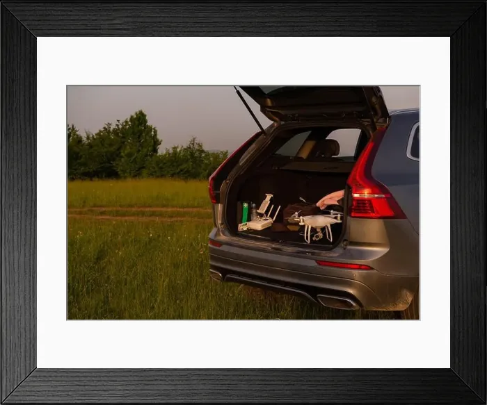 Framed Print : drone ready for fly in suv trunk landscape nature mountains sunset