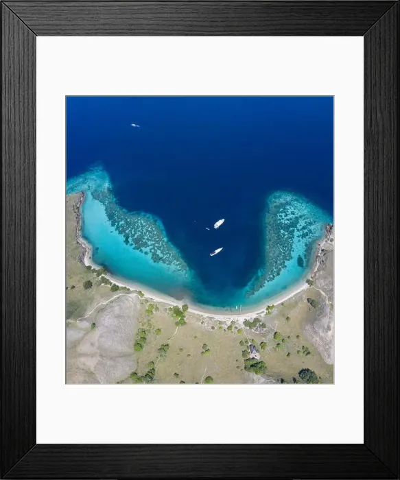 Framed Print : Seen from an aerial view, a healthy coral reef fringes the beautiful island of Gili Darat within Komodo National Park Framed Print : Seen from an aerial view, a healthy coral reef fringes the beautiful island of Gili Darat within Komodo National Park