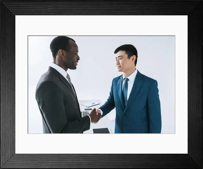 Framed Print : side view of african american and asian businessmen shaking hands after meeting Framed Print : side view of african american and asian businessmen shaking hands after meeting