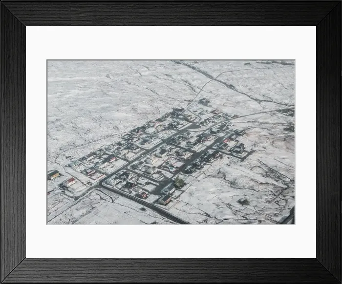 Framed Print : Aerial view of Faroese village covered in snow as seen from a helicopter during an early spring morning on the Faroe Framed Print : Aerial view of Faroese village covered in snow as seen from a helicopter during an early spring morning on the Faroe
