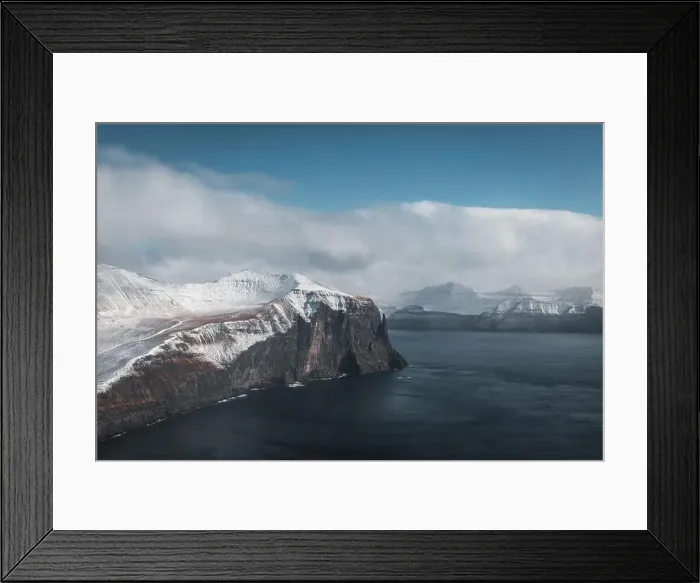 Framed Print : Aerial shot of Trollkonufingur from a helicopter with view of snow-covered peaks Framed Print : Aerial shot of Trollkonufingur from a helicopter with view of snow-covered peaks