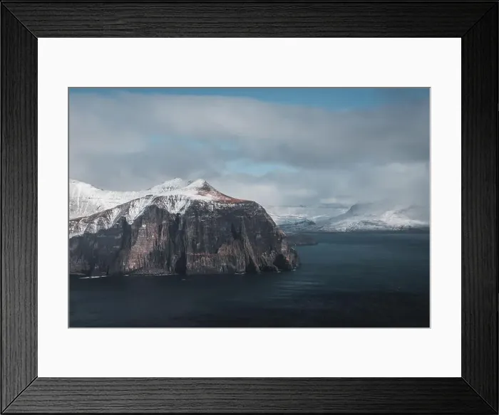 Framed Print : Aerial shot of Trollkonufingur from a helicopter with view of snow-covered peaks Framed Print : Aerial shot of Trollkonufingur from a helicopter with view of snow-covered peaks