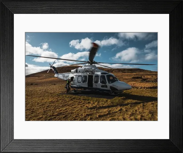 Framed Print : Helicopter on the island Koltur being loaded by a local woman right before starting during a sunny spring morning Framed Print : Helicopter on the island Koltur being loaded by a local woman right before starting during a sunny spring morning