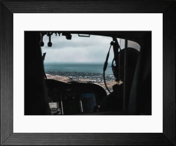 Framed Print : Aerial shot of the snow-covered town Torshavn taken from the inside of a helicopter during a flight over the Faroe Framed Print : Aerial shot of the snow-covered town Torshavn taken from the inside of a helicopter during a flight over the Faroe