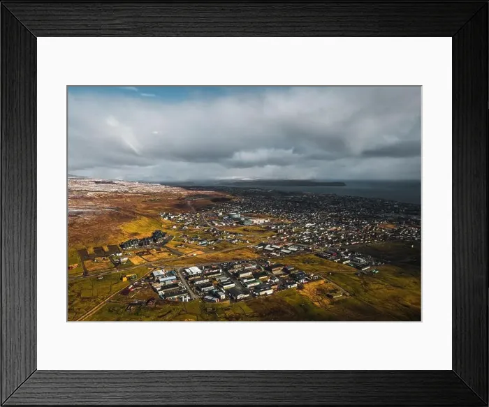 Framed Print : Aerial shot of the town Torshavn as taken during a helicopter flight on an early spring morning with snow-covered Framed Print : Aerial shot of the town Torshavn as taken during a helicopter flight on an early spring morning with snow-covered