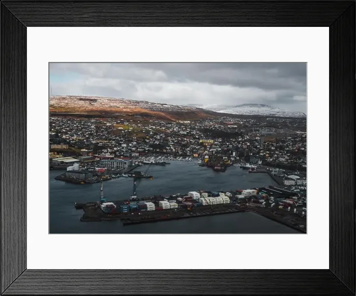 Framed Print : Aerial shot of the town Torshavn and its harbour as taken during a helicopter flight on an early spring morning Framed Print : Aerial shot of the town Torshavn and its harbour as taken during a helicopter flight on an early spring morning