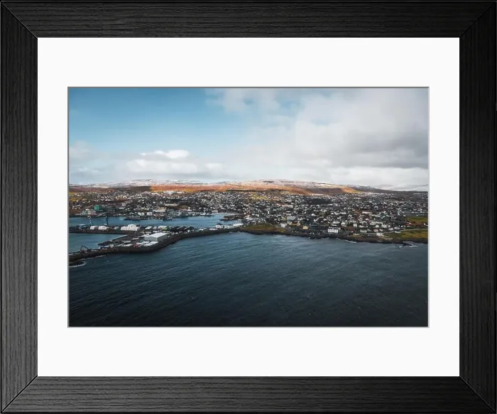 Framed Print : Aerial shot of the town Torshavn and its harbour as taken during a helicopter flight on an early spring morning Framed Print : Aerial shot of the town Torshavn and its harbour as taken during a helicopter flight on an early spring morning