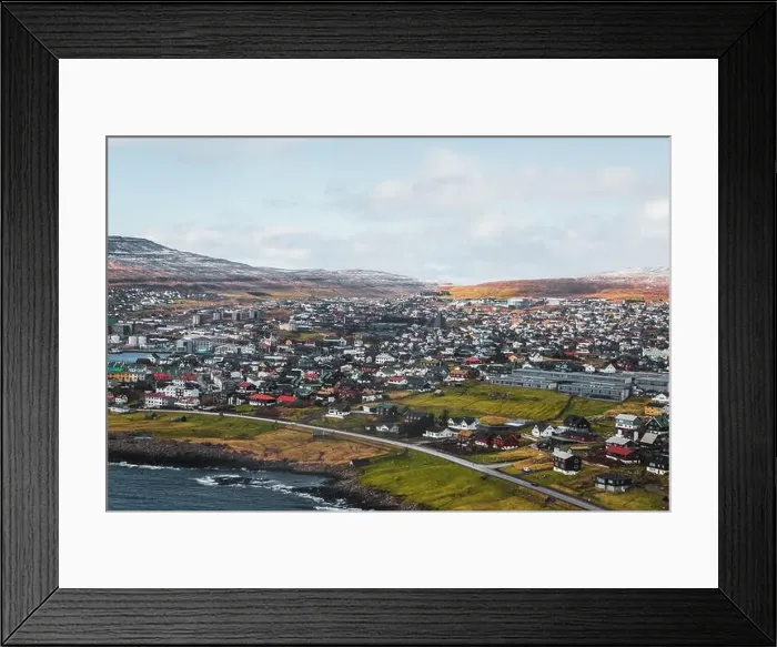 Framed Print : Aerial shot of the town Torshavn as taken during a helicopter flight on an early spring morning with snow-covered Framed Print : Aerial shot of the town Torshavn as taken during a helicopter flight on an early spring morning with snow-covered