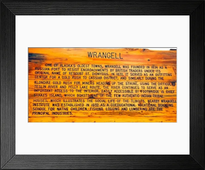 Framed Print : An outdoor weather-worn wooden sign explains the early history of Wrangell Framed Print : An outdoor weather-worn wooden sign explains the early history of Wrangell