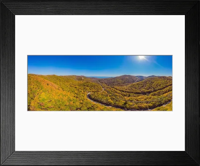 Framed Print : Aerial view of road in beautiful autumn forest at sunset